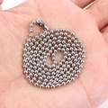 Close-up of silver stainless steel ball chain necklace resting on a person's palm - Silver Ball Chain Necklace