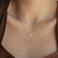 Elegant gold V-shaped necklace with sparkling rhinestones for women on model neck - V Shape Pave Zirconia (xp-116 Gold)