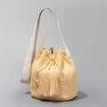 Handwoven straw bucket bag in natural yellow with fringe tassels and embroidered strap - 22cmx22cmx17cm / Beige