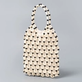 Handgefertigte Perlenhandtasche mit beige-schwarzem Geometriemuster und Innenfutter - Elfenbein mit schwarzen Perlen