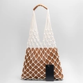 White handwoven cotton mesh tote bag with brown leather lining and smartphone for scale - White with Brown