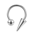 Close-up of polished stainless steel horseshoe ring with spike and ball ends piercing - Ball And Spike Style / Silver