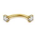 Dettaglio macro del piercing al sopracciglio curvo dorato con due zirconi da 3mm - Oro