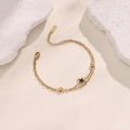 Double-layered 18K gold plated bracelet with black star pendant and zircon stones - Black Star and Zircon Style (SL051-2)