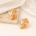 Detailed macro view of irregular 18K gold earrings with pink marble enamel inlay - EH410 - Orange / 18K Gold