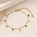 Dettaglio di bracciale in titanio dorato con ciondoli in zircone e logo S.Steel - Stile Farfalla (SL053-15)