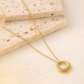 Minimalist 18K gold plated titanium necklace with polished ring pendant on stone stand - High Polished Ring Pendant Cross Chain (XL111)