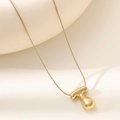 Detailed macro view of 18K gold-plated T-shaped pendant on a sleek snake chain - Letter T Bubble Style (XL152-T)