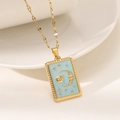 Golden tarot sun and moon square pendant necklace with light blue enamel on unique lip chain - Blue