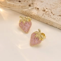 Close-up of strawberry-shaped pink enamel stud earrings with golden 304 stainless steel - Purple Strawberry Style