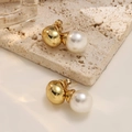 Detailed view of elegant gold metal ball and white pearl stud earrings on a beige stone surface - Metal Ball Large Pearl Style (EH563)