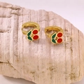 Detail of gold cherry hoop earrings with red enamel charms on natural stone - Cherry Ear Buckle