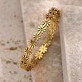 Elegant 18K gold-plated daisy bracelet with sparkling diamond centers on beige stone - 18K Gold / Gold