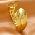 Macro shot of gold stainless steel bangle showing irregular floral petal design and texture - Abstract Leaf Streamline Style (SZ122)