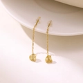 Detail shot of long gold tassel earrings with textured heart charms on white ceramic - Pentagon (EH697-Pentagon)