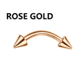 Close-up of a rose gold curved barbell with spike ends for eyebrow and nose piercing - Rose Gold Curved Barbell with Double Spike Ends