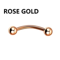 Macro view of polished rose gold curved barbell piercing with symmetric spherical ends - Rose Gold Curved Barbell with Double Ball Ends