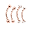 Close-up of four rose gold curved eyebrow rings with round balls and zircon settings - 4 Pieces/Set / Rose Gold