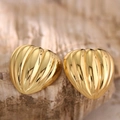Macro view of golden heart studs with radial shell-like texture and bright luster - Shell Radial Ribbed (EH088)
