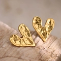 Golden irregular heart earrings with hammered texture on a natural stone background - Irregular Hammered (EH016)