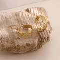 Detailed close-up of gold 18k plated textured hoop earrings on a natural stone base - Braided Chain Texture Hoop Style (EH194)