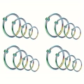 Detail van 16 regenboog roestvrijstalen captive bead ringen in verschillende maten - Veelkleurig