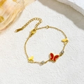 Bracelet papillon en acier titane avec émail rouge et breloques dorées pour femmes - Papillon Nacre Rouge Incrusté Zirconium (70012) / Or