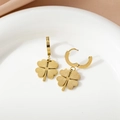 Elegant gold titanium steel clover hoop earrings with radial patterns on a ceramic tray - Four-Leaf Clover Pattern Earrings (E066A) / Gold