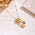 Collier en acier titane avec pendentifs soleil et œil du démon en zircons dorés - Style de Tournesol (81428-1)