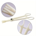 White disposable plastic piercing forceps with round opening and ergonomic ring handles - Triangle Slotted Pliers