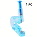Detail view of a single-use light blue ear piercing gun with a sterile steel needle - Single Unit - Transparent Blue Ear Piercer