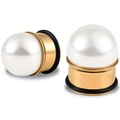 Macro detail of gold-plated ear gauges with large white pearls and black O-ring seals - 6mm / Gold