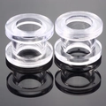 Macro shot of clear acrylic ear tunnels with double flared design and mirror reflection - US 2 / Clear