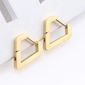 Detailed macro view of gold geometric pentagon earrings on white display card - Irregular Heart Gold