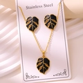 Golden stainless steel jewelry set with black enamel monstera leaf pendant and earrings - Monstera Leaf Style (TZ261-Black)