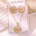 Macro view of stainless steel butterfly jewelry set with white marble texture and gold plating - Butterfly Style (TZ259-White)