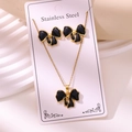 Set di gioielli in acciaio inossidabile dorato con collana e orecchini a fiocco nero - Stile Fiocco (TZ255-Black) / Oro + Nero