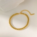 Close-up of golden stainless steel wheat chain bracelet with lobster clasp and extender - Gold / Bracelet
