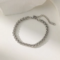 Close-up of stainless steel spiga chain with lobster clasp and S. STEEL tag - Steel / Bracelet