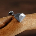 Macro detail of F136 titanium cartilage stud with diamond-cut top on wooden branch - Geometric Diamond