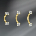 Detail of 16G curved eyebrow rings in gold finish with brilliant round-cut zircon stones - Gold with Zirconia