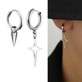 Macro detail of asymmetric stainless steel hoop earrings with spike and star pendants - Solid Spike and Hollow Star Style