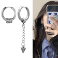 Detailed view of asymmetric punk earrings with long chain and spike pendant on model - Thick Hoop with Mini Rings and Cone Tassel Style