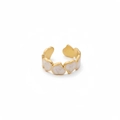 Detailed close-up of gold open ring featuring linked white marble heart patterns - Adjustable Open / Gold