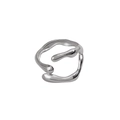 Detailed macro view of an irregular silver stainless steel ring with liquid lava texture - Steel