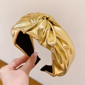 Fashionable gold metallic PU knotted headband featuring a stylish wide twisted design - Gold