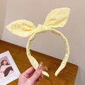 Cute yellow rabbit ear headband with white daisy embroidery and sweet bow detail - Egg Yellow