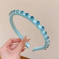 Handcrafted light blue satin headband featuring sparkling blue rhinestone embellishments - Blue