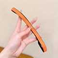 Elastisches rutschfestes Sport-Stirnband in Orange-Schwarz für Laufen und Fitness - Orange