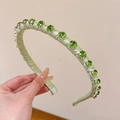 Elegant light green satin headband featuring sparkling emerald green rhinestones decoration - Green
